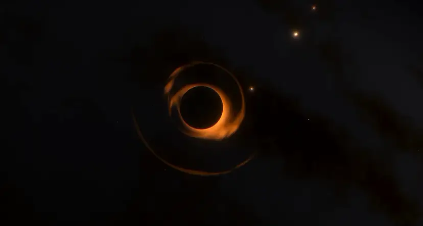 Un’eclissi totale al rallentatore: un disco scuro cinto da una corona ambrata tra le stelle
